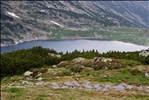 Shiny surface of Bucura Lake from hiking trail